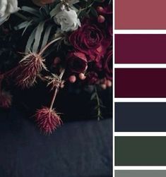 a bouquet of flowers sitting on top of a table next to a color swatch