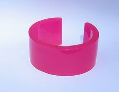 Height 3.5 cm- 3.2 cm opening. 6.3 cm approx inner diameter (at largest point) Fits most wrists.Glows pink. Unique Adjustable Pink Cuff Bracelet, Trendy Luminous Jewelry For Gifts, Trendy Handmade Cuff Bracelet For Party, Handmade Pink Cuff Bracelet For Gift, Pink Plastic Rave Bracelets, Pink Party Cuff Bangle Bracelet, Pink Party Cuff Bracelet Bangle, Pink Plastic Bangle Jewelry, Hot Pink Bracelets