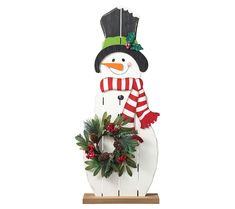 Elevate your holiday decorations with this porch decor featuring a vibrant design that captures the joyful spirit of the season. Adorned with exquisite artificial floral accents and crafted from solid wood, this unique snowman shape brings a touch of brightness to any space. From Glitzhome. Snowman Porch Decor, Metal Snowman, Wood Spindle Bed, Wood Snowman, Spindle Bed, Indoor Christmas Decorations, Indoor Christmas, Christmas Figurines, Christmas Wood