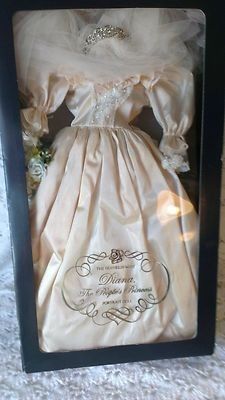 a wedding dress in a black box