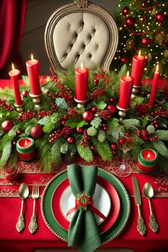 a christmas table setting with red and green decorations