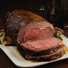 a large piece of meat sitting on top of a white plate