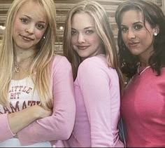 three young women standing next to each other