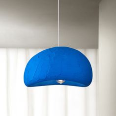 a blue light hanging from a ceiling in a room