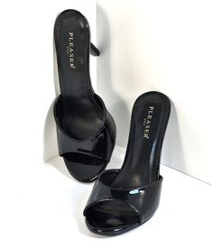 Step into a classic pair of black pumps! A vintage style of black slip ons with a peep toe touch is crafted in a flattering glossy leatherette and a comfortable heel for any of your day to night looks. A cushioned insole prepares you for the perfect comfort you can rely on, and a simple silhouette will make these your go-to pair! Please note these shoes have a 2-3 day handling time before they will ship from our warehouse and there is a 10% restocking fee if you choose to return. Black Heels Vintage, Black Vintage Heels, Vintage Black Heels, Heels Unique, Heels Vintage, Halloween Shoes, Black Peep Toe Heels, Slip On Heels, Dr Shoes