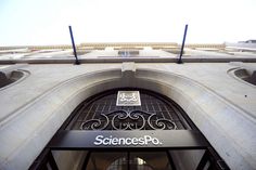 an entrance to a building with a sign that says science so on it's side