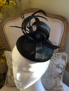 Item:  Black button base fascinator with black feathers, sinamay loops and netting.  size: 14.5 x 3.5cms high (approx), Total height inc feathes (approx 20 cms), length (approx. 20 cms).    Description:  A gorgeous button base sinamay fascinator (in Black) attached with an elastic with black croque feathers, black sinamay loops, netting and biot feathers.  made to order!   Customise: If you would like something added, deleted or changed, please send me a message to see if it is possible. If you Sinamay Fascinator, Black Fascinator, Human Head, Mannequin Heads, Black Feathers, Gift Accessories, Black Button, Air Mail, Fascinator