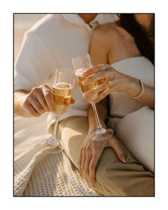 a man and woman holding glasses of champagne