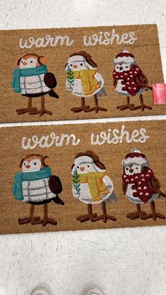 two door mats with birds on them that say warm wishes and warm wishes