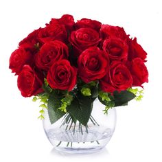 a vase filled with red roses on top of a table