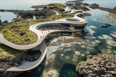 an aerial view of the water and walkways in front of some rocky coastlines