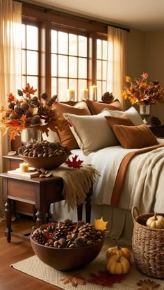 a bed room with a neatly made bed and fall decorations