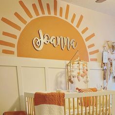 a baby's room with an orange and white theme