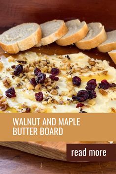 a wooden cutting board topped with sliced bread and cranberry cheese covered in nuts