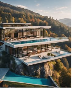 an aerial view of a modern house on top of a cliff in the middle of mountains