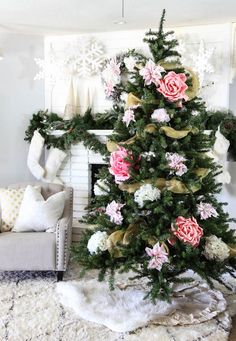 a christmas tree decorated with pink and white flowers