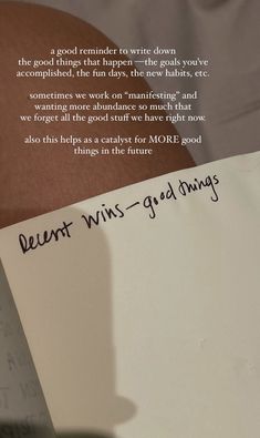 a person holding a piece of paper with writing on it next to a note that says, dear win - good things