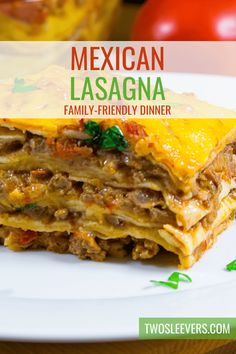 mexican lasagna family - friendly dinner recipe on a plate with tomatoes in the background