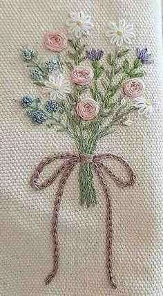 a bouquet of flowers on a white cloth