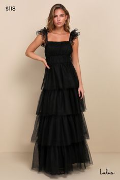 We're totally head over heels for the Lulus Tulle For Love Black Mesh Tulle Tiered Ruffled Maxi Dress and we think you will be too! Lightweight tulle and airy mesh come together to shape this stunning dress. Elasticized straps boast sculptural ruffled trim as they support a bodice with a square neckline (with hidden no-slip strips) and an empire waist. Skirt has a voluminous tiered design, finishing at a maxi hem. Hidden zipper/clasp at side. Fit: This garment fits true to size. Length: Floor le Black Tulle Dress With Ruffles, Black Tulle Gown With Ruffles, Black Layered Tulle Dress, Tiered Black Tulle Dress, Black A-line Maxi Dress With Ruffles, Black Tulle Dress, Modest Prom, Tulle Maxi Dress, Banquet Dresses