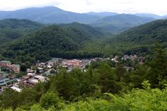 a town nestled in the mountains surrounded by trees