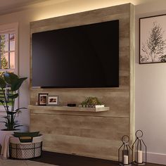 a large flat screen tv mounted to the side of a wall in a living room