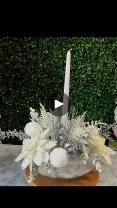 a table topped with a cake covered in frosting and flowers