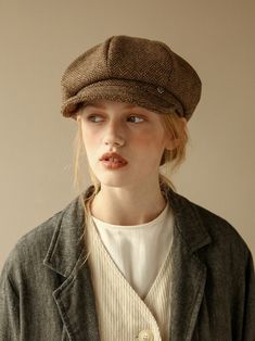 a woman wearing a brown hat and jacket