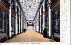 an old postcard shows the inside of a building with columns and glass ceilinging