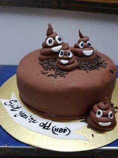 a chocolate cake decorated with googly eyes and decorations