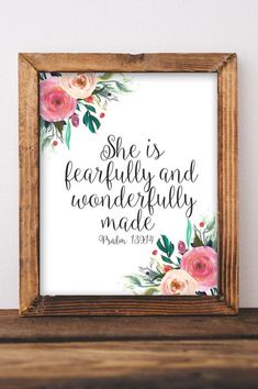 a wooden frame with flowers and bible verse on it