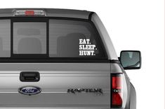 a truck with the words eat sleep hunt on it's back window sticker