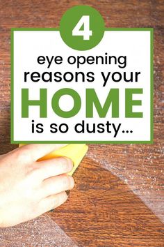 a person cleaning a wooden table with a yellow sponge and green text that says, 4 eye opening redons your home is so dusty