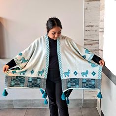 "Beautiful ponchos made of baby alpaca, very soft and warm, they are double side to wear. it is one size. Three colors: Turquoise, red  and pink. Very warm and comfortable to wear them at home this winter, with llama designs around it  that represent Peruvian ponchos. Measure L:54\" x W:40\"" Artisan Shawl, One Size Alpaca Shawl In Cape Style, One Size Alpaca Shawl Outerwear, Handmade Alpaca Poncho For Winter, Bohemian Alpaca Shawl One Size, Alpaca Shawl Outerwear, One Size Bohemian Alpaca Poncho, Traditional Red Shawl Poncho, One Size Alpaca Poncho Shawl