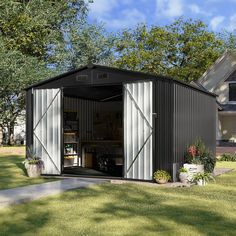 a garage with its doors open in front of a house