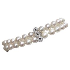 A beautifully made elegant authentic freshwater pearl bracelet that anyone can use in their jewelry collection. Pearls are decadent and one of the most coveted materials for jewelry. This bracelet is featured in a 18k white gold with a diamond encrusted detailing on the clasp. Pair this elegant piece of jewelry with a Chanel tweed blazer set and some Prada heels for a sophisticated look. Weight: 25.91 g Length: 7 inches Composition: freshwater pearl, diamond, 18k gold Luxury Pearl Drop Bracelet For Formal Occasions, Luxury Pearl Chain Bracelet For Formal Occasions, Elegant Pearl Bracelet For Formal Occasions, Luxury White Gold Pearl Oyster Bracelet, Elegant Pearl Chain Beaded Bracelet For Formal Occasions, Elegant White Gold Beaded Bracelets For Anniversary, Luxury Pearl Drop Bracelets With Round Beads, Luxury Pearl Bracelet With Round Beads And Charm, Luxury Bracelets With Pearl Drop And Round Beads