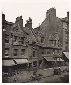 an old black and white photo of some buildings