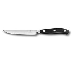 a large knife with black handles on a white background