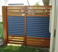 a wooden fence with blue slats on it