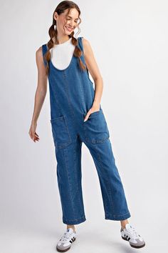 Mineral washed solid sleeveless jumpsuit featuring adjustable straps, a scoop neckline, two open front pockets and is a straight leg style. Model is 5'9" and wearing a small.75%COTTON 23%POLYESTER 2%SPANDEX Spring Medium Wash Overalls With Adjustable Straps, Blue Overalls With Adjustable Straps For Spring, Spring Blue Overalls With Adjustable Straps, Casual Dark Wash Bib Front Overalls, Spring Overalls With Slip Pockets And Relaxed Fit, Spring Casual Jumpsuits And Rompers With Adjustable Straps, Casual Sleeveless Shortalls With Pockets, Casual Spring Jumpsuits And Rompers With Adjustable Straps, Casual Jumpsuits And Rompers With Adjustable Straps For Spring