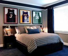 a bedroom with three framed sports jerseys on the wall and a bed in front of it