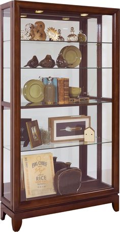 a wooden display case with glass doors and shelves filled with different types of items in it