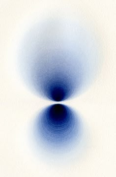 an abstract blue and white background with circles in the center, on top of a white surface