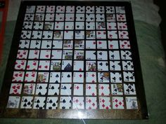 playing cards laid out on top of each other in order to be made into a board game