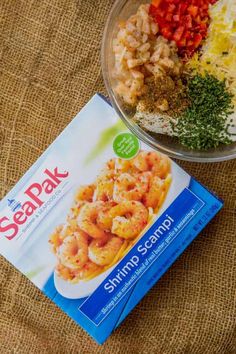 the meal is prepared and ready to be eaten on the table, including shrimp, rice, and seasoning