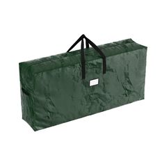 a large green bag sitting on top of a white floor next to a black handle