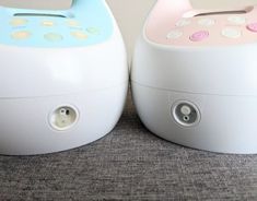 two white and pink humiders sitting next to each other on top of a carpet