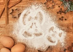 flour, eggs and spices on a wooden table