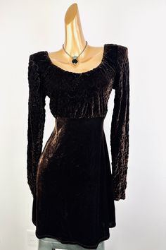 This 90s velvet dress is dark brown in color and is fashioned of stretch velvet. It has a scooped neckline with long sleeves. The condition is very good! The marked size is M, and would best fit a size medium. Please measure yourself before buying if you plan on wearing it.  MEASUREMENTS: (Measurements are taken of the garment laying flat and not stretched) BUST: 36-38" WAIST: 30" HIP: 38" LENGTH: 36" (From shoulder to hem) MANNEQUIN MEASURES: Bust: 33 Waist: 24 1/2' Hip: 36 Invent: LH406 90s Dark Fashion, 90s Velvet Dress, 90s Grunge Dress, Charlotte Fashion, Grunge Shorts, 90s Velvet, Babydoll Mini Dress, Grunge Dress, Dress Velvet