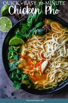 chicken noodle soup in a black bowl with limes and cilantro on the side